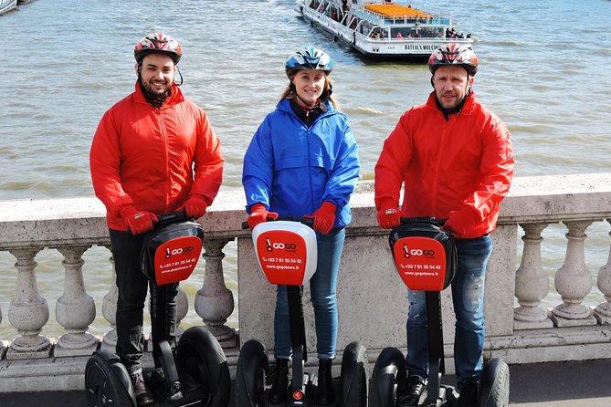 Paris Segway Tour with Ticket for Seine River Cruise with tourists enjoying the ride.