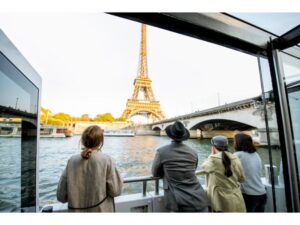 People enjoying beautiful landscape view on the riverside with Eiffel tower