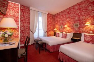 Hotel Clément features elegant red bedroom