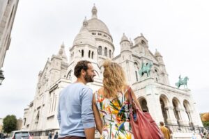 Eiffel Tower, Seine River Cruise & Montmartre Small Group Visit features couple traveling together