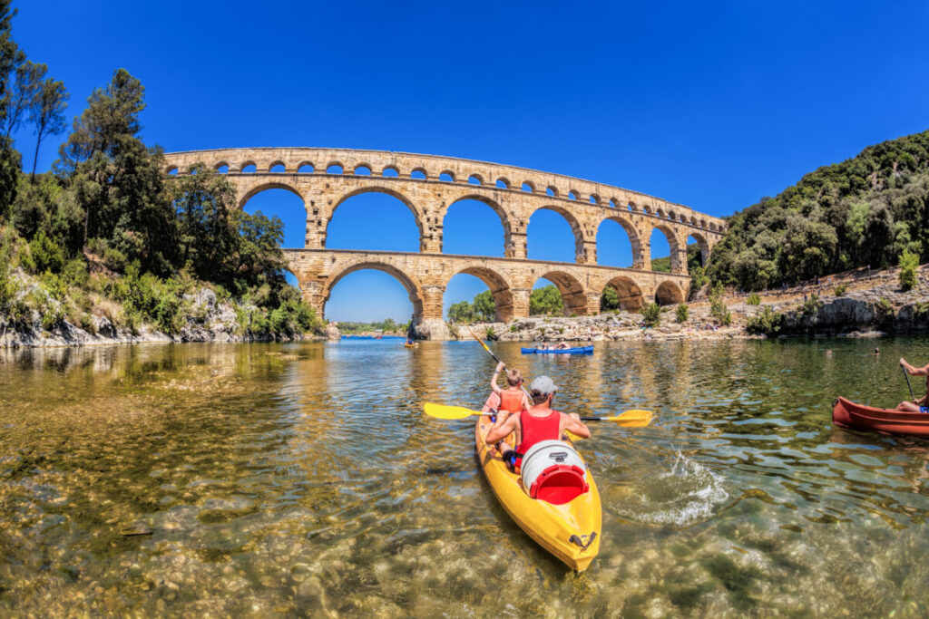 The Pont du Gard, an ancient Roman aqueduct bridge, is a testament to the impressive engineering of the Roman Empire. Located in southern France, it spans the Gardon River and once carried water 50 kilometers from Uzès to the city of Nîmes over 2,000 years ago. 