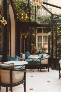 The featured image of Hôtel de l'Abbaye showcases the charming facade framed by lush greenery, inviting guests to a tranquil retreat in the heart of Paris.