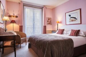 Hôtel Sainte-Beuve's rooms are a harmonious blend of comfort and sophistication, featuring stylish decor, plush furnishings, and modern amenities.