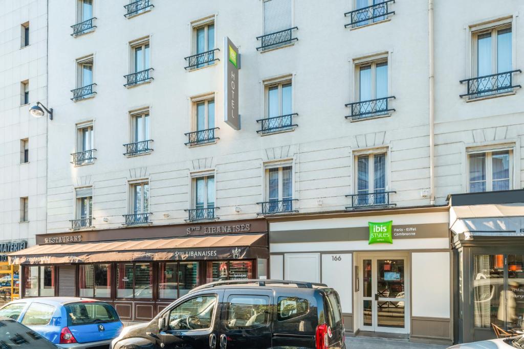 Vibrant and modern lobby at ibis Styles Paris Eiffel Cambronne, adorned with contemporary decor and welcoming ambiance.