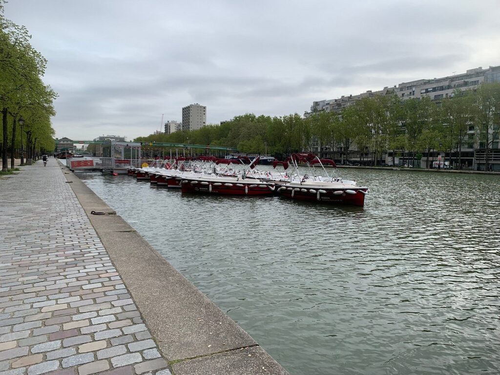 Boat and the view of Bassin de la Villette in Paris, France