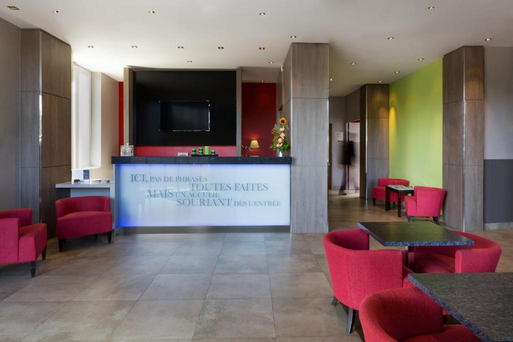 Stepping into the lobby of Best Western Seine West Hotel reveals a welcoming and tastefully decorated space, blending modern aesthetics with comfort.