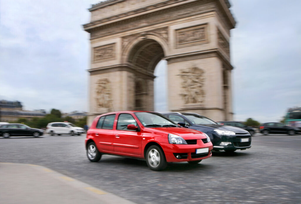 Car traffic at the Arc de Triomphe in Paris, France