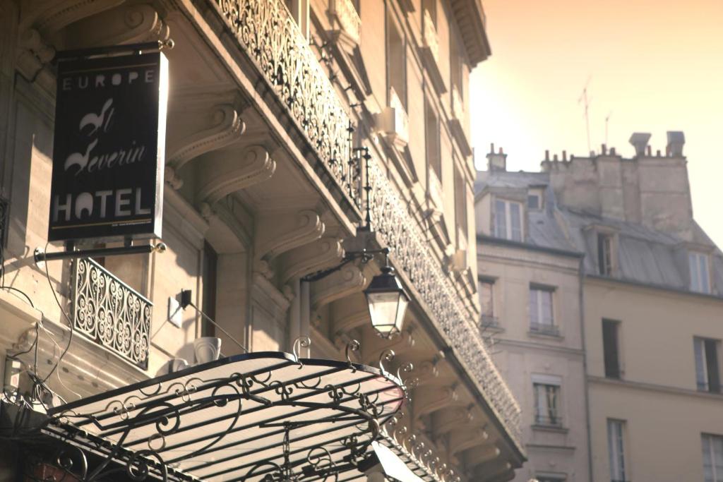 "Hôtel Europe Saint-Séverin welcomes with its historic facade and inviting entrance, hinting at the charm within.