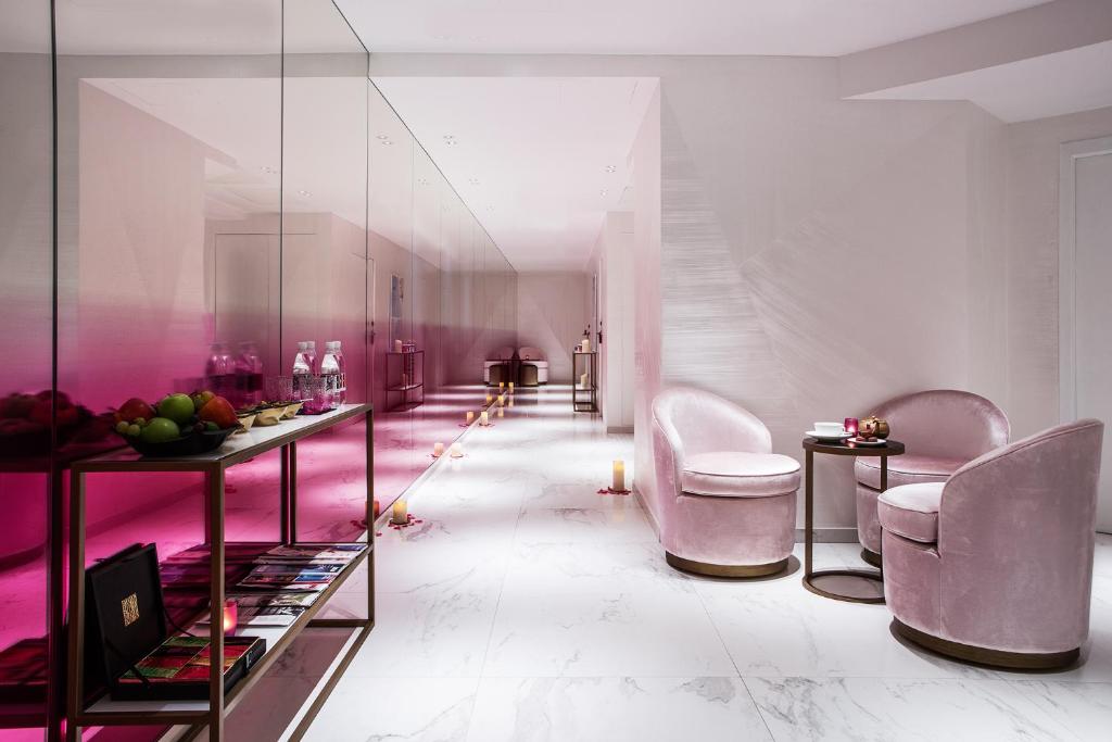 Step into the opulent lobby of Hôtel Fauchon, where modern luxury meets Parisian elegance.