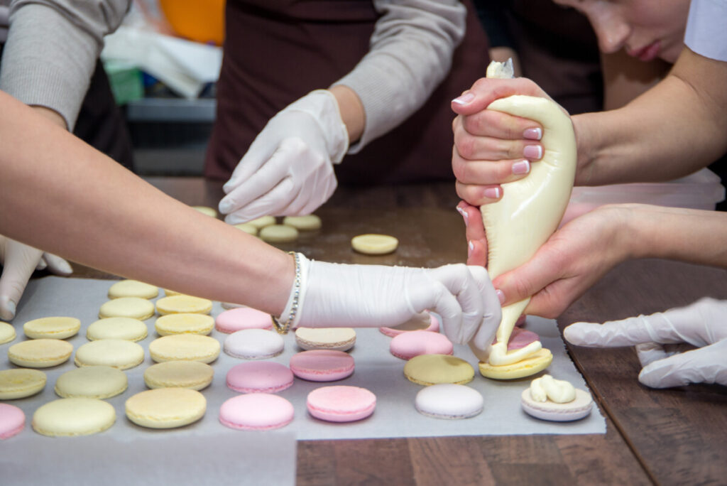 Group on a French macarons baking class working together