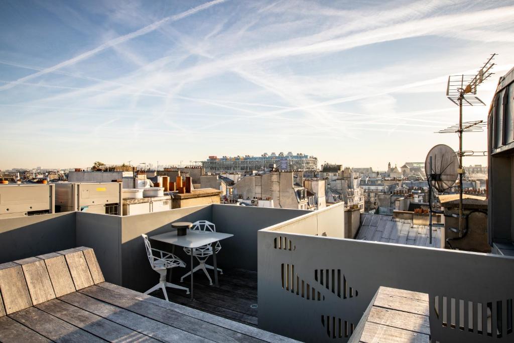 The rooftop of Hôtel des Ducs D'Anjou offers a breathtaking panoramic view of the iconic landmarks and vibrant streets of Paris.