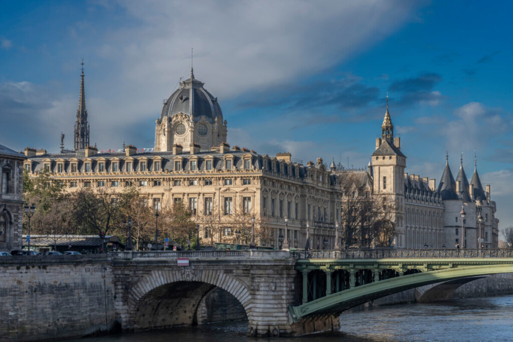 Panoramic view of Pont au Change and La Conciergerie on Ile de la Cité from quai de Seine