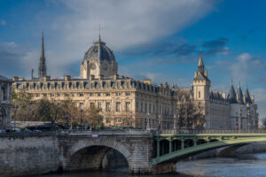 Panoramic view of Pont au Change and La Conciergerie on Ile de la Cité from quai de Seine