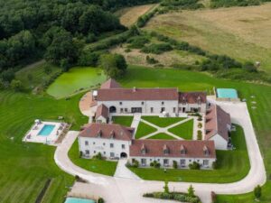 Le Prieuré de Boulogne Aerial View: A breathtaking perspective unveils the timeless beauty of Le Prieuré de Boulogne, nestled amidst lush greenery and historic architecture.