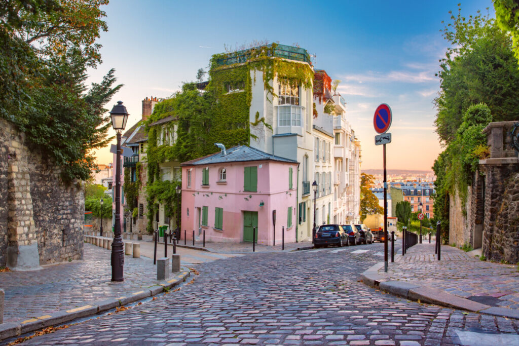 Scenic old street and houses sunset view in Paris, France