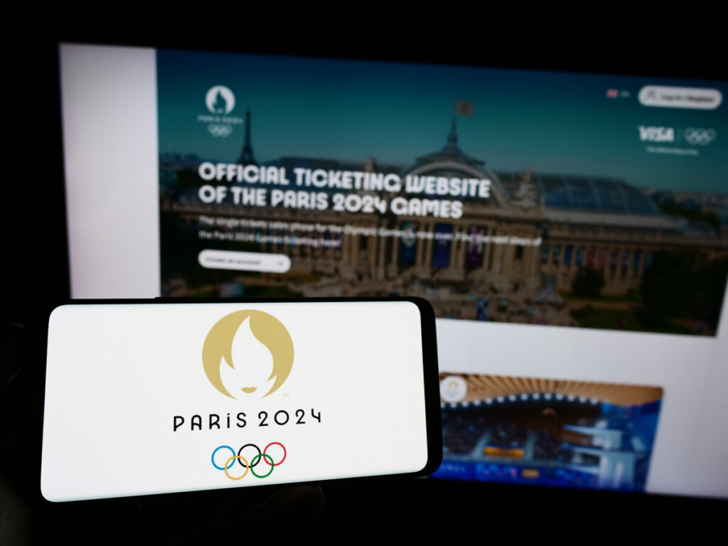 Paris Olympics Official Ticketing Website and Paris Olympics on a phone screen