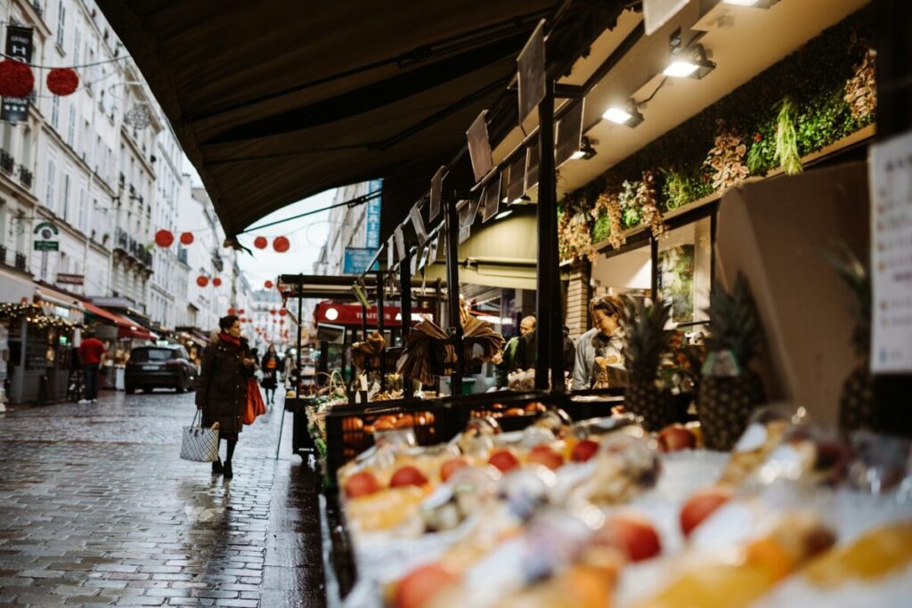 Woman shopping on a market in Paris, France