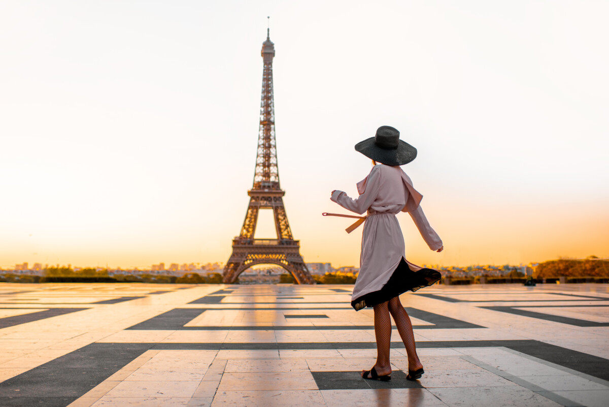 Woman on the square with beautiful view on the Eiffel tower in Paris