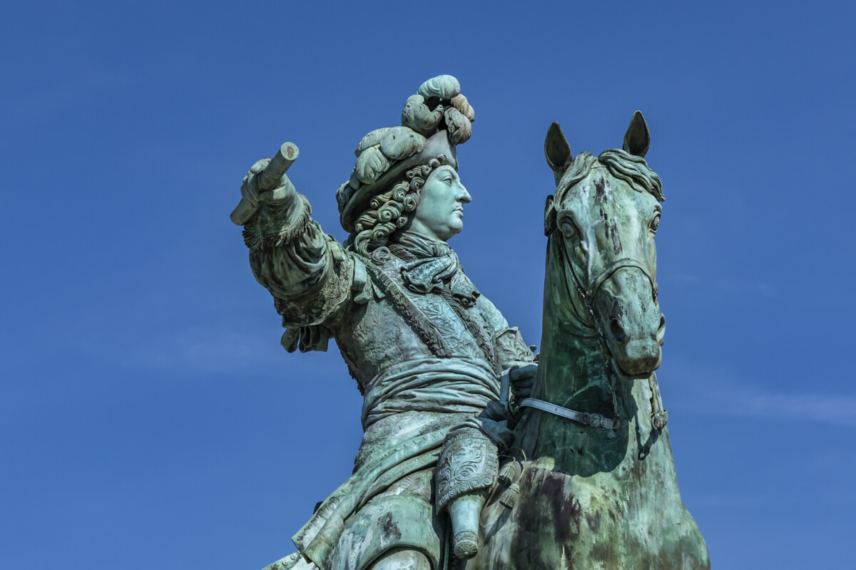 Equestrian statue of Louis XIV (1836) in front of Palace of Versailles. Palace Versailles was a royal chateau. Versailles, Paris, France.